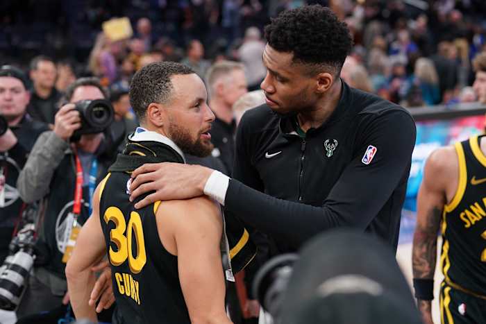 Milwaukee Bucks forward Giannis Antetokounmpo (34) and Golden State Warriors guard Stephen Curry (30)